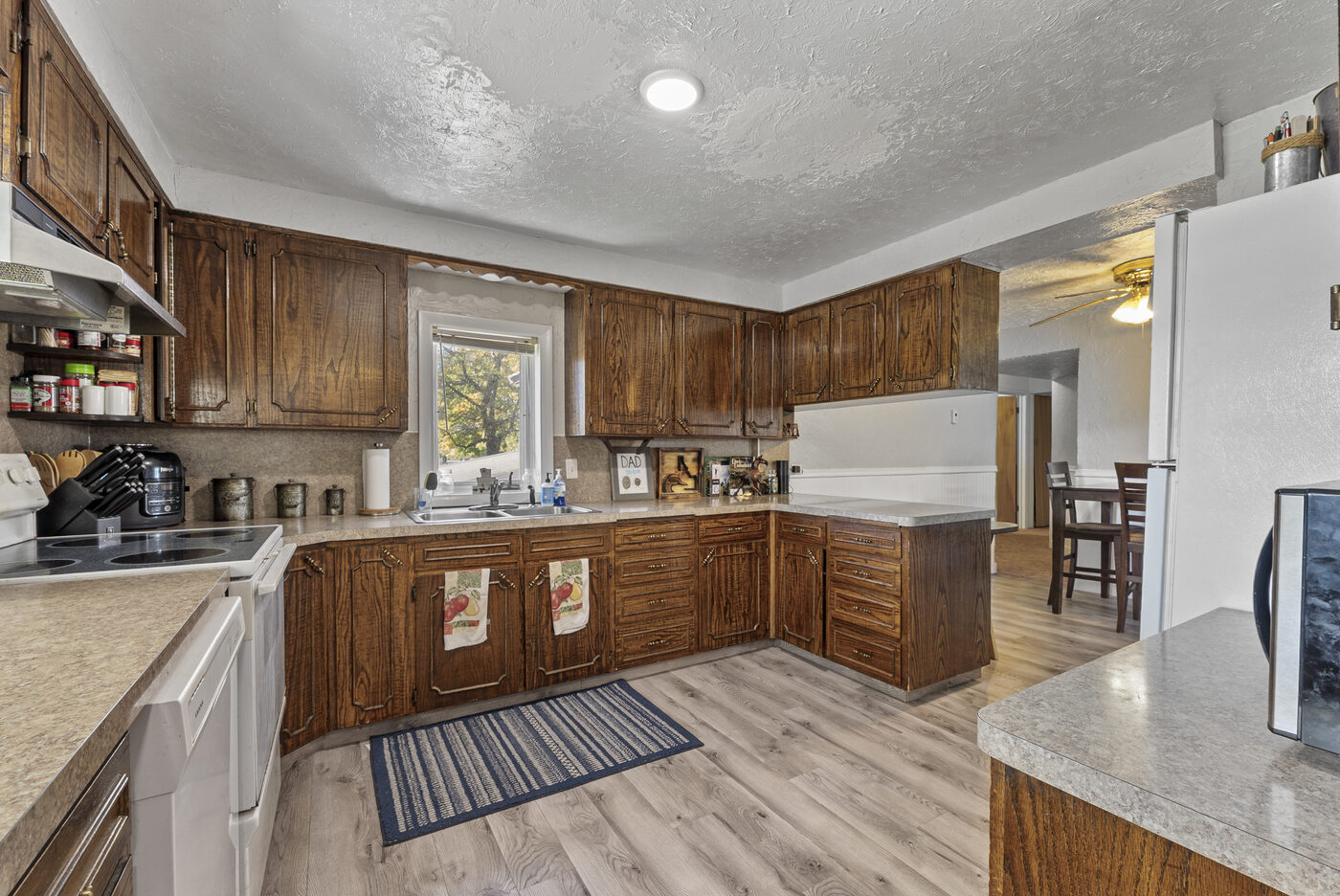 Kitchen wide view toward dining